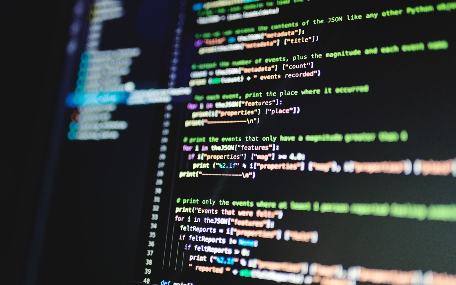 A text editor open on a monitor showing a robots.txt file with GPTBot and CCBot disallow rules, office background