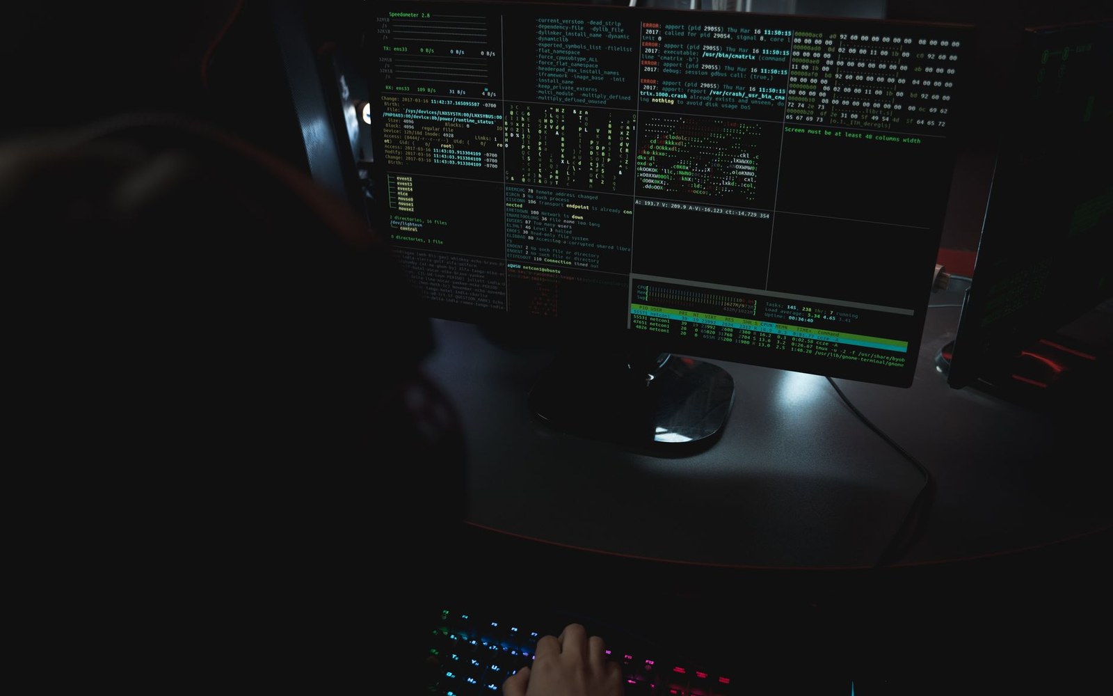 Terminal window on a dark monitor showing a raw Atom feed in XML, angle brackets and namespaces visible, person's hands on keyboard
